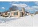 Side view of Ranch home in winter at 502 W 38Th St, Indianapolis, IN 46208