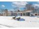 Ranch home exterior, snow covered yard at 502 W 38Th St, Indianapolis, IN 46208