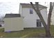 Back of house with sliding glass door and storage shed at 504 Grand Woods Dr, Indianapolis, IN 46224