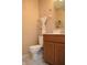 Updated bathroom with wood vanity and tile floor at 504 Grand Woods Dr, Indianapolis, IN 46224