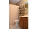 Bathroom with polka dot shower curtain and wood vanity at 504 Grand Woods Dr, Indianapolis, IN 46224