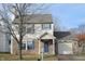 Brick and vinyl-sided two-story house with attached garage and landscaping at 504 Grand Woods Dr, Indianapolis, IN 46224