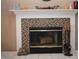 Fireplace with tile surround and hearth at 504 Grand Woods Dr, Indianapolis, IN 46224