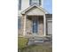 Blue front door with wreath, located under covered entryway at 504 Grand Woods Dr, Indianapolis, IN 46224