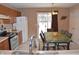 Kitchen with oak cabinets and view to backyard at 504 Grand Woods Dr, Indianapolis, IN 46224