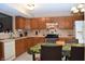Kitchen boasts oak cabinets and stainless steel appliances at 504 Grand Woods Dr, Indianapolis, IN 46224