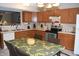 Kitchen with oak cabinets, and a dining area at 504 Grand Woods Dr, Indianapolis, IN 46224