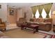 Living room with brown sofas, coffee table, and southwestern decor at 504 Grand Woods Dr, Indianapolis, IN 46224