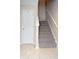 Staircase with carpeted steps and tile flooring at 504 Grand Woods Dr, Indianapolis, IN 46224