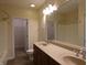 Double vanity bathroom with a large mirror and shower at 513 N Park Ave, Indianapolis, IN 46202