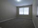 Spacious bedroom with neutral walls and carpeting at 513 N Park Ave, Indianapolis, IN 46202