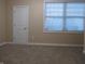 Simple bedroom with neutral walls and carpeting at 513 N Park Ave, Indianapolis, IN 46202