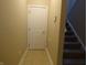 Hallway with tile floor, door, and stairs at 513 N Park Ave, Indianapolis, IN 46202