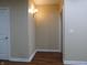 Neutral hallway with hardwood floors and wall sconces at 513 N Park Ave, Indianapolis, IN 46202