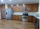 Modern kitchen with stainless steel appliances and wood cabinets at 513 N Park Ave, Indianapolis, IN 46202