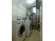 Laundry room with washer, dryer, and shelving at 513 N Park Ave, Indianapolis, IN 46202