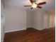 Hardwood floor living room with neutral walls and ceiling fan at 513 N Park Ave, Indianapolis, IN 46202
