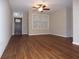 Spacious living room with hardwood floors and ceiling fan at 513 N Park Ave, Indianapolis, IN 46202