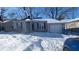 Cute ranch home with attached garage, snow-covered yard at 5708 N Keystone Ave, Indianapolis, IN 46220