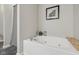 Bathroom featuring a large tub with tile flooring and wall art at 6595 Reserve Dr, Indianapolis, IN 46220