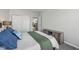 A bedroom with plush carpet, plenty of storage, and soft, natural lighting at 6595 Reserve Dr, Indianapolis, IN 46220