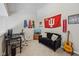 Bedroom featuring a desk, tv, and a black couch with Indiana Hoosiers decor at 6595 Reserve Dr, Indianapolis, IN 46220