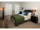 Inviting bedroom with neutral tones, comfortable furnishings, and plenty of natural light at 6595 Reserve Dr, Indianapolis, IN 46220