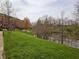 Scenic view of community buildings, landscaping, and creek, creating a serene and inviting atmosphere at 6595 Reserve Dr, Indianapolis, IN 46220