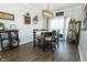 Charming dining area with modern lighting, stylish decor, and access to outdoor balcony at 6595 Reserve Dr, Indianapolis, IN 46220
