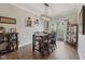 This dining room features a sleek light fixture, hardwood floors, and sliding door access to a small balcony at 6595 Reserve Dr, Indianapolis, IN 46220