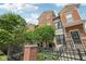 Two-story brick townhomes with wrought iron fences at 6595 Reserve Dr, Indianapolis, IN 46220