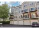 Three-story townhomes featuring attached garages and multiple balconies at 6595 Reserve Dr, Indianapolis, IN 46220