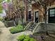 Charming townhomes feature brick exteriors, well-maintained lawns, and inviting entryways, enhancing the curb appeal at 6595 Reserve Dr, Indianapolis, IN 46220