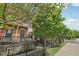 Two-story brick townhomes featuring a fenced yard at 6595 Reserve Dr, Indianapolis, IN 46220