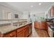 Bright kitchen features granite countertops and stainless steel dishwasher at 6595 Reserve Dr, Indianapolis, IN 46220