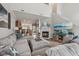 Open-concept living space with a cozy fireplace, modern TV setup, and views into the kitchen at 6595 Reserve Dr, Indianapolis, IN 46220