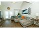 Bright and airy living room with a large sectional sofa, and a door leading to the balcony at 6595 Reserve Dr, Indianapolis, IN 46220