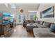 Bright and open living room featuring a large sectional sofa and sliding doors at 6595 Reserve Dr, Indianapolis, IN 46220