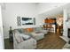 Bright and airy living room with a large sectional sofa, neutral walls and a fireplace at 6595 Reserve Dr, Indianapolis, IN 46220