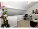 Cozy loft area with neutral walls, a functional desk setup and a comfortable seating area perfect for relaxation or work at 6595 Reserve Dr, Indianapolis, IN 46220