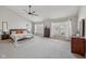 Spacious main bedroom with vaulted ceiling, large windows, and a ceiling fan create a serene retreat at 6595 Reserve Dr, Indianapolis, IN 46220