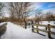 Snow-covered path and walkway leading towards the townhome community at 6595 Reserve Dr, Indianapolis, IN 46220