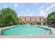 Community pool with a view of the townhome complex in the background at 6595 Reserve Dr, Indianapolis, IN 46220