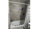 Clean bathroom featuring a bathtub, gray tile, and a shower with curtain at 81 Middleton Rd, Franklin, IN 46131