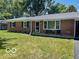 Brick ranch home with a well-maintained lawn and a covered porch at 81 Middleton Rd, Franklin, IN 46131