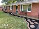 Brick ranch house with landscaped front yard and stone walkway at 81 Middleton Rd, Franklin, IN 46131