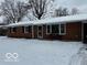 Brick ranch house covered in snow at 81 Middleton Rd, Franklin, IN 46131