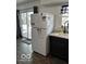 White refrigerator in kitchen with dark cabinets at 81 Middleton Rd, Franklin, IN 46131