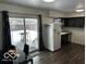 Eat-in kitchen with dark cabinets and sliding door at 81 Middleton Rd, Franklin, IN 46131