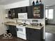 Kitchen with granite countertops and dark cabinets at 81 Middleton Rd, Franklin, IN 46131